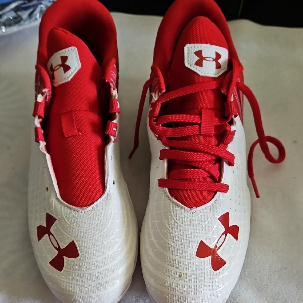 Under Armour Red and White cleats with Textured Design